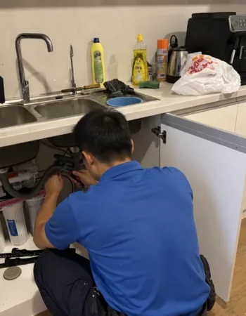 Technician Installing Under-Sink Purifier