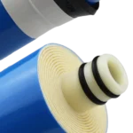 Close-up of an 1812 RO membrane end showing spiral layers, centre tube and two black sealing rings